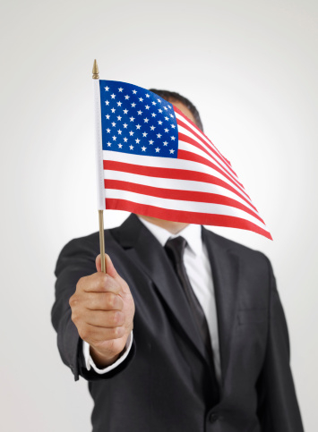 Businessman holding USA flag