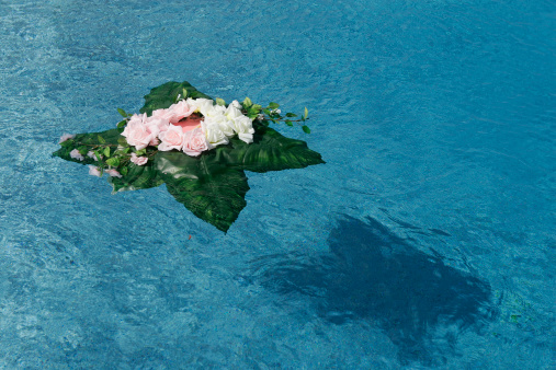 Flower bouquet floating in the water