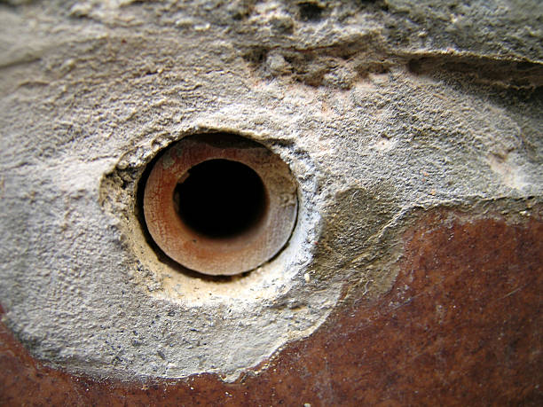 Hole in the wall Macro stock photo