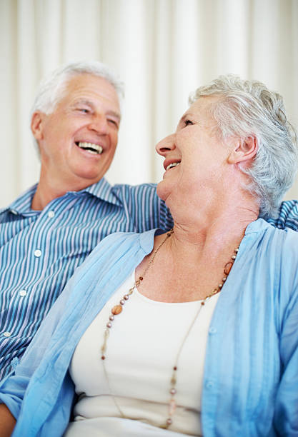 istock Laughing old couple looking at eachother 182182826