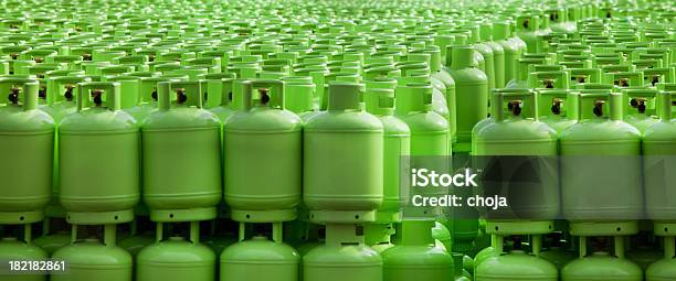 Storage Of Butane Gas Cylinders Stock Photo - Download Image Now - Natural Gas, Bottle, Green Color