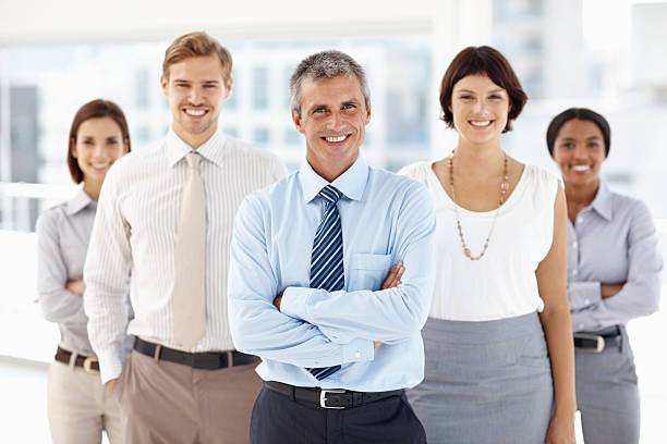 istock Team of business executives smiling 182183152