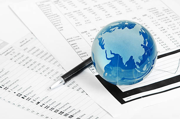 istock Glass globe and pen on finance 182183188