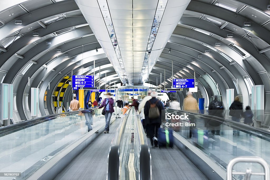 Travellers on Moving Walkway at Airport "airport tunnel with people in motion, Frankfurt, Germany,Frankfurt Airport, Germany" Airport Stock Photo