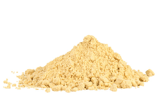 Pile of mustard powder isolated on white background.