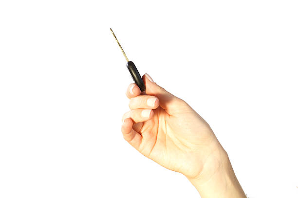 istock Female hand holding car key 182183848