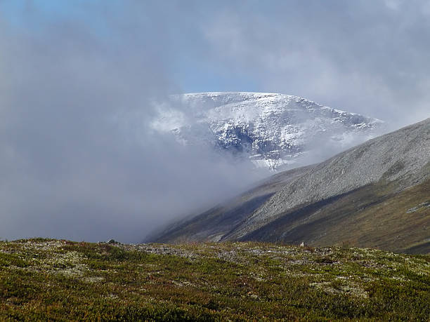 Peak in the clouds stock photo