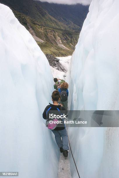 Climbing Through An Ice Crevice Stock Photo - Download Image Now - Autumn, Beauty, Claustrophobia