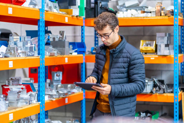 istock Engineer using tablet in the warehouse of a cnc factory 1821856953