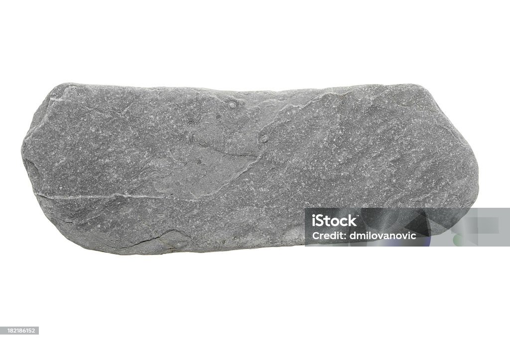 Stone isolated on white Photo of flat, gray stone isolated on a white background. Stone - Object Stock Photo