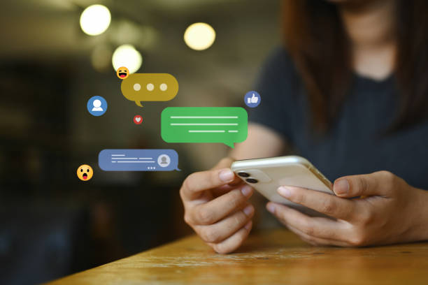 istock Young woman using social media, commenting and sharing posts commenting on mobile phone 1821868783