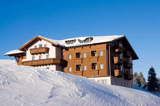 istock Single hotel in winter landscape 182186914