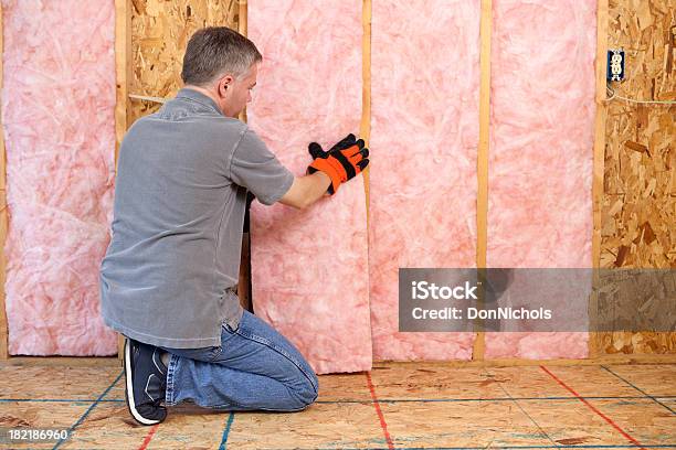 Man Installing Insulation Stock Photo - Download Image Now - Insulation, Home Interior, Residential Building
