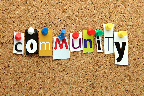 Community word pinned onto a corkboard
