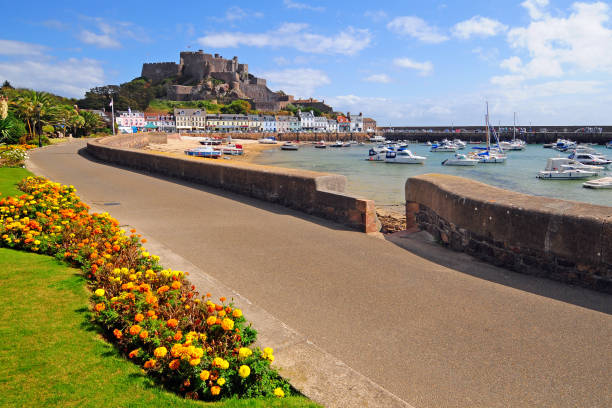 Gorey Harbour Jersey Gorey Harbour and Mont Orgueil Castle in Jersey, Channel Islands circa 14th century photos stock pictures, royalty-free photos & images