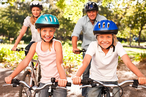 istock Family cycling at the park 182187224