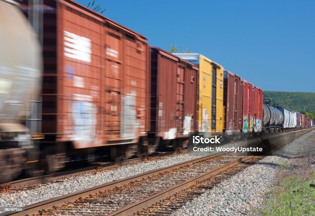 Moving Freight "A freight train in motion on a sunny,cloudless day." Freight Train Stock Photo