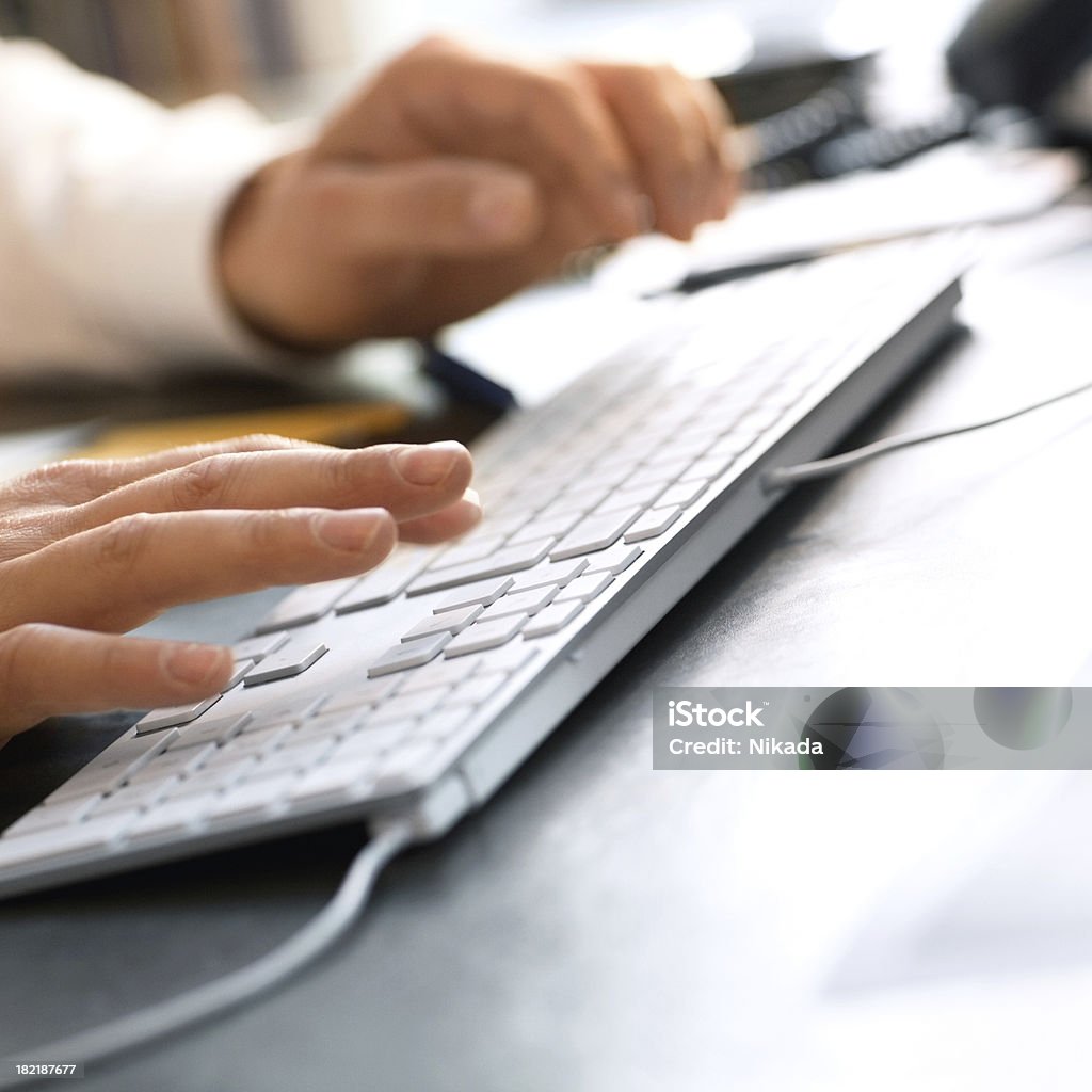 Businessman working Human hands typing on computer keyboard Adult Stock Photo