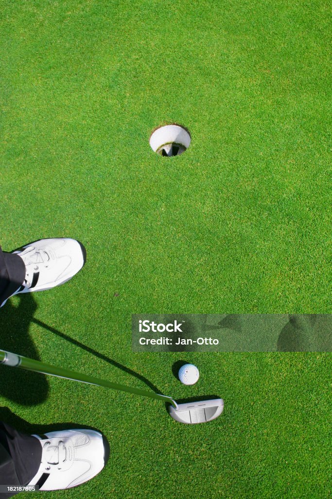 Putting auf green - Lizenzfrei Einlochen - Golf Stock-Foto
