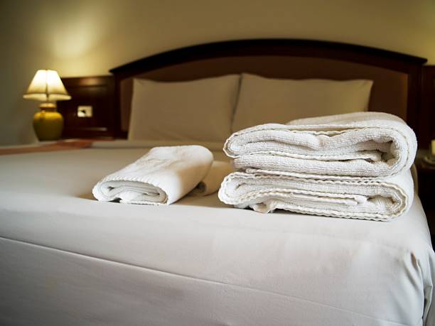 istock Hotel bedroom with towels on bed 182187828