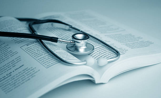 istock A stethoscope placed on top of an open medical book 182187839