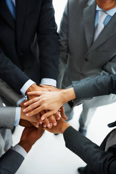 istock Business colleagues joining hands together 182187956