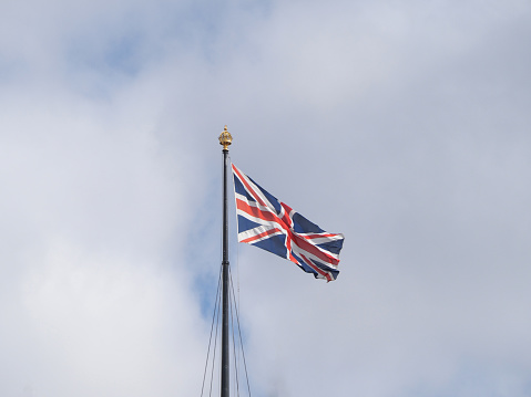 A Close-up of the Norway flag is on the left side on a gray background with copy space for text