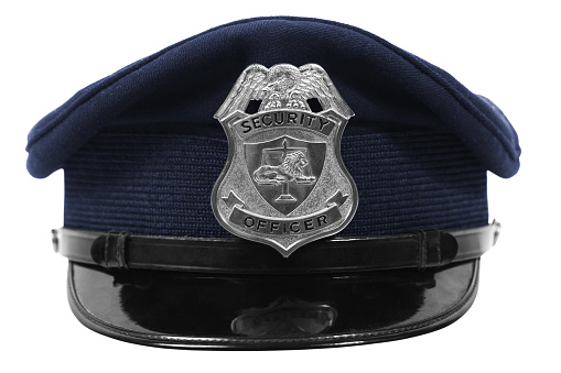 Generic security officer badge on a blue hat.