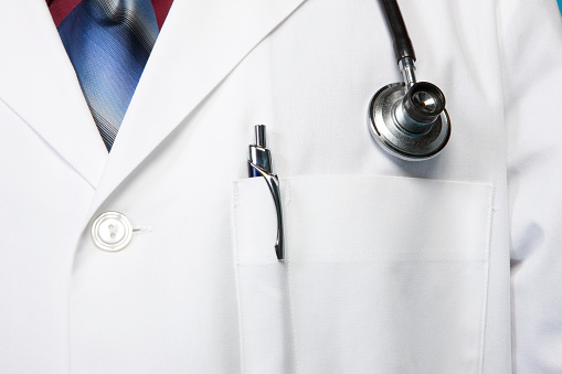 Close-up of a doctor's lab coat with stethoscope.View More. 