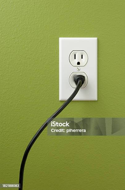 An Electrical Outlet With A Plug Inserted Stock Photo - Download Image Now - Electrical Outlet, Cable, Power Cable