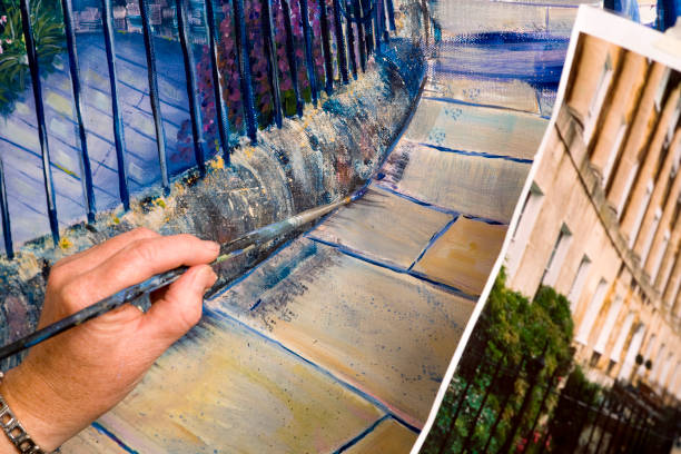 istock Lady artist at work painting a large acrylic artwork 182188184