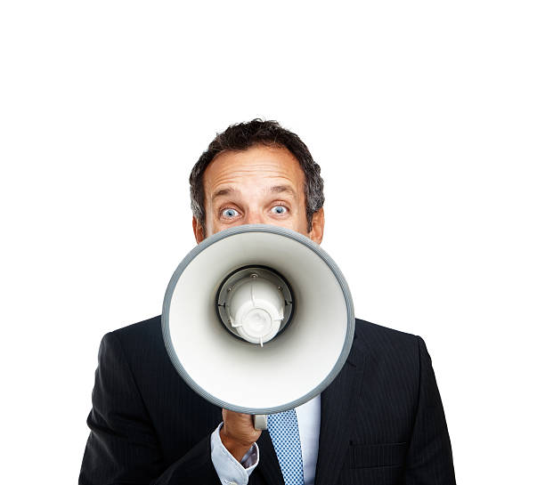 istock Mature businessman shouting into a megaphone 182188203