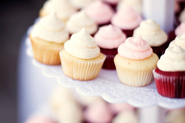 Wedding Cupcakes Fun cupcakes with swirly frosting on top. wedding cake close up macro stock pictures, royalty-free photos & images