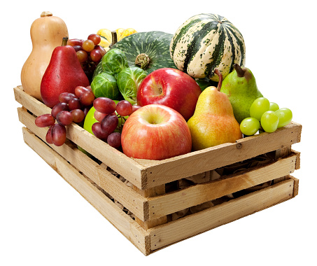 Variety of fresh fall fruits and vegetables in wood crate. Clipping path included for easy selection.