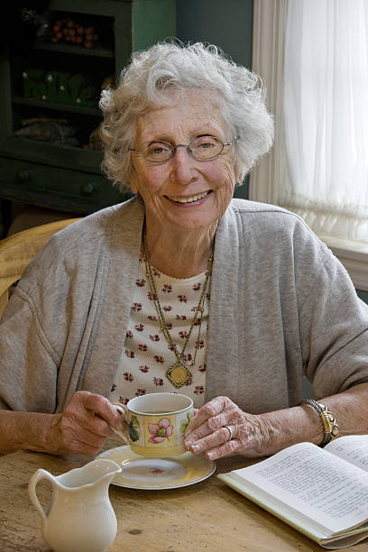 senior adult taking a coffee break stock photo