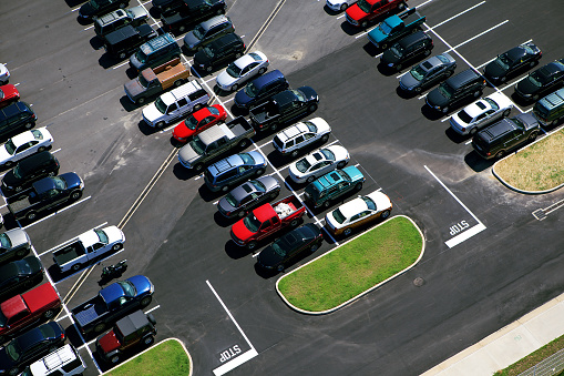 Aerial view of almost full parking lot.