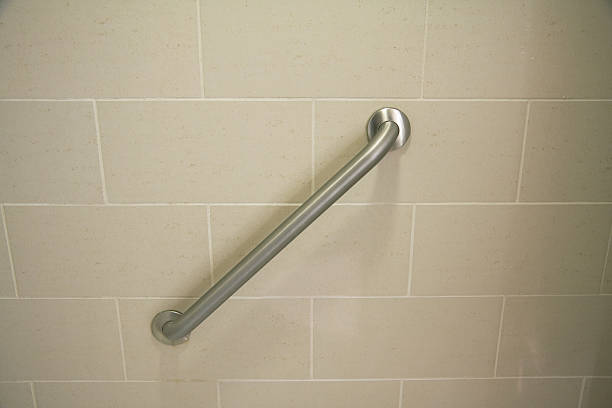 safety hand bar in a hotel shower stock photo