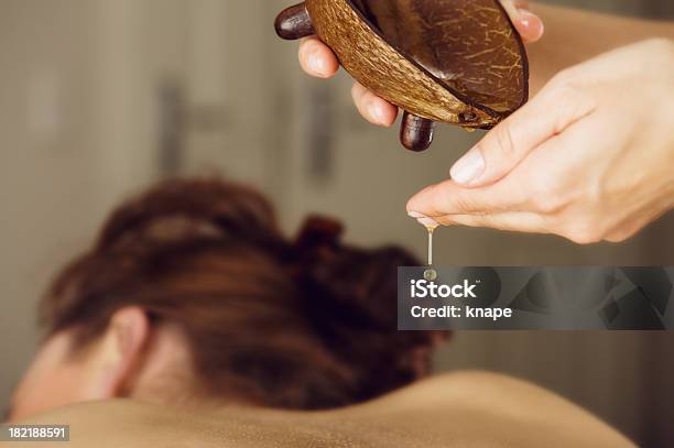 Woman At Spa On A Massage Table Stock Photo - Download Image Now - Massage Oil, Pouring, Focus On Foreground