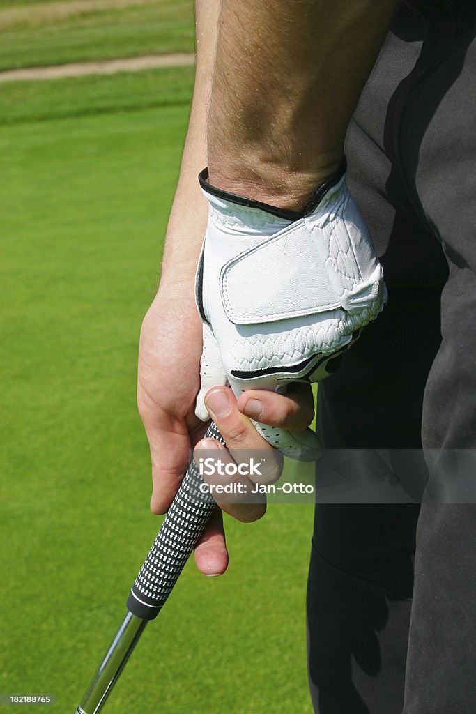 Halte die Indoor-Golfanlage "putter - Lizenzfrei Golfhandschuh Stock-Foto