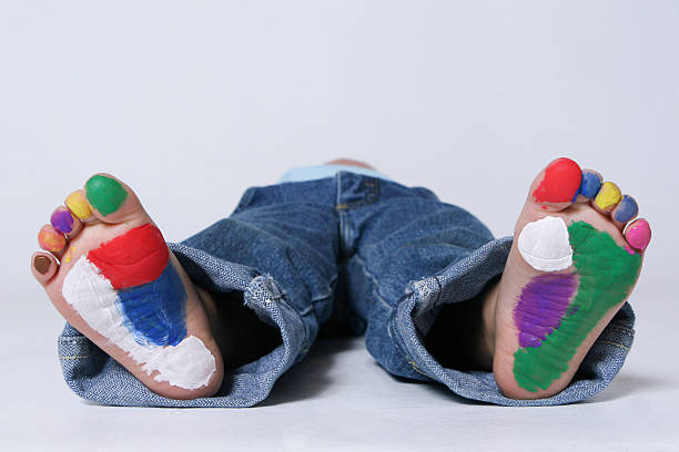 Child with painted feet stock photo
