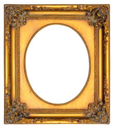 An ornate gilded oval picture frame.  Ideal for Portraits. Isolated on white with clipping paths.