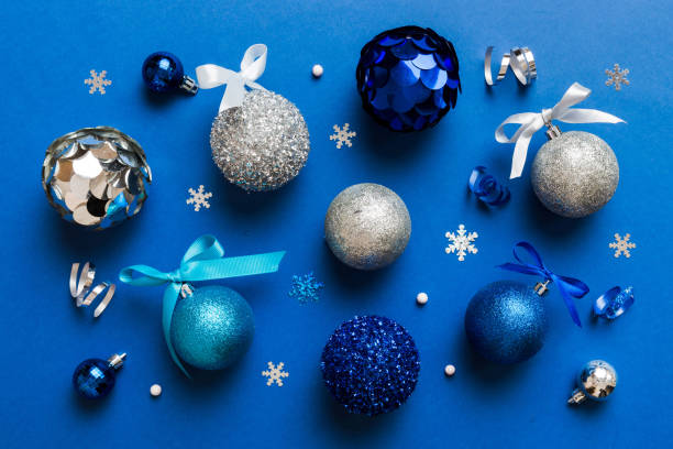 istock Christmas ball on colored background. decoration bauble with ribbon bow with copy space 1821889007