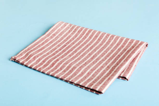 istock top view with red empty kitchen napkin isolated on table background. Folded cloth for mockup with copy space, Flat lay. Minimal style 1821889070