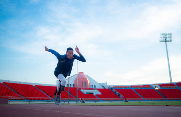 istock Disabled athletes prepare in starting position ready to run on stadium track 1821890811