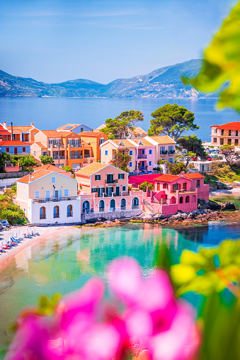 Assos, Greece. Picturesque village Kefalonia, Ionian islands. Beautiful colorful houses and turquoise colored bay.