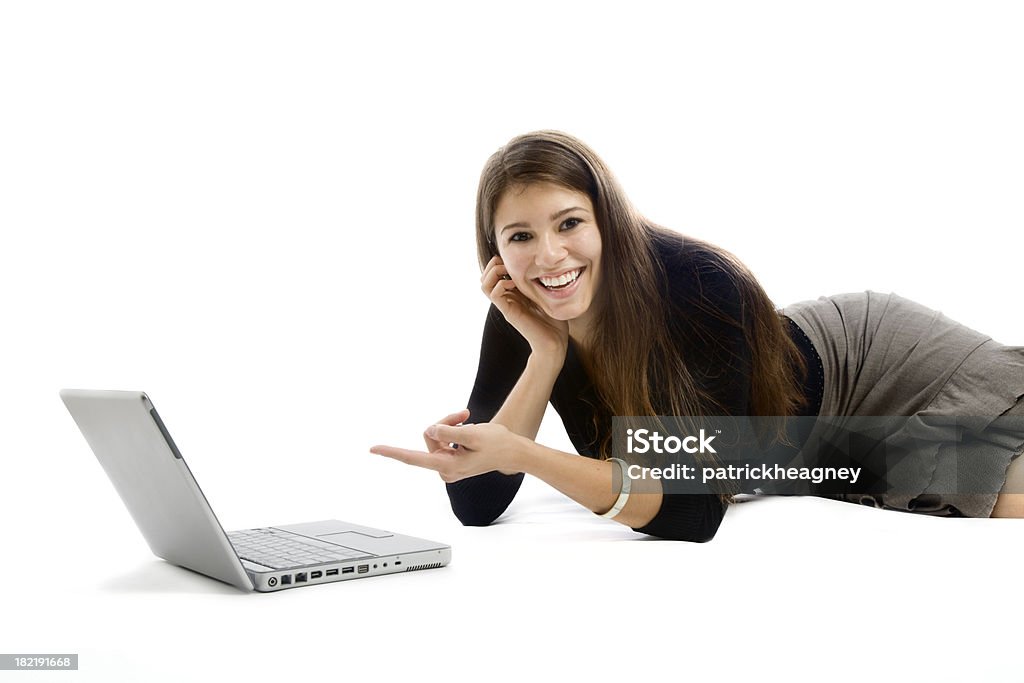 Donna con computer portatile che punta - Foto stock royalty-free di Adolescente