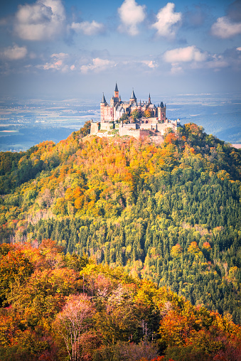 Hohenzollern Burg, Germany - October 16, 2021. Autumn breathtaking landscape with Hohenzollern Castle in Swabian Alps - Baden-Wurttemberg.
