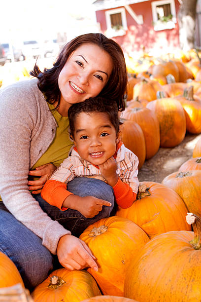 istock Mother and Son at a Pumpkin Patch 182192126