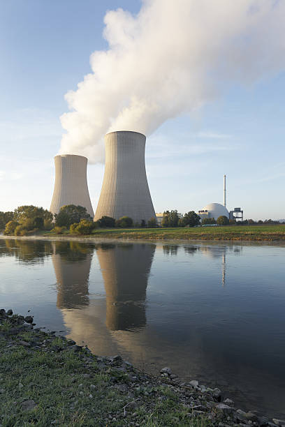 istock Riverside nuclear power station with steaming cooling towers (XXL) 182192307