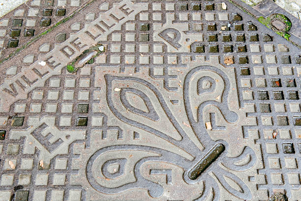 Manhole cover in Lille, France stock photo